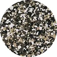 A circular pattern of scattered, irregular shapes in various shades of black, white, brown, and tan. The shapes overlap and create a camouflage-like effect.