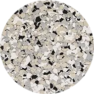 A circular pattern featuring a mix of beige, white, grey, and black irregular shapes resembling a stone or terrazzo texture.